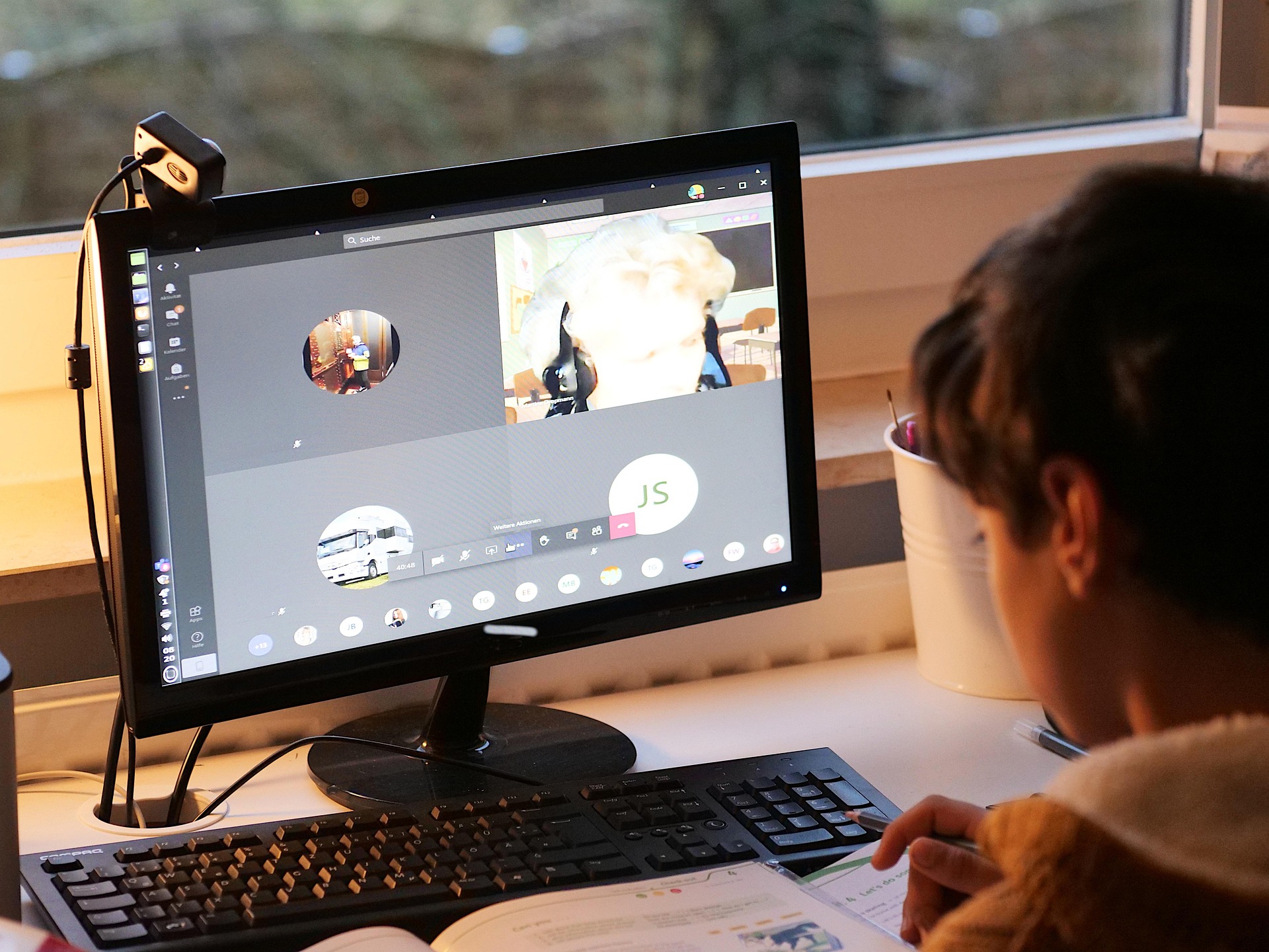 Online tutor preparing a live class from home